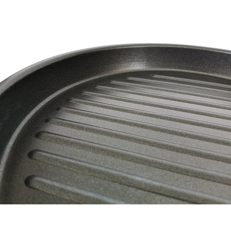 How does the internal double-layer Teflon spraying improve the non-stick performance of the baking sheet?